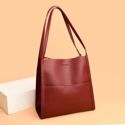 Leather carrying bag with multiple compartments