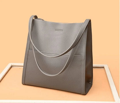 Leather carrying bag with multiple compartments