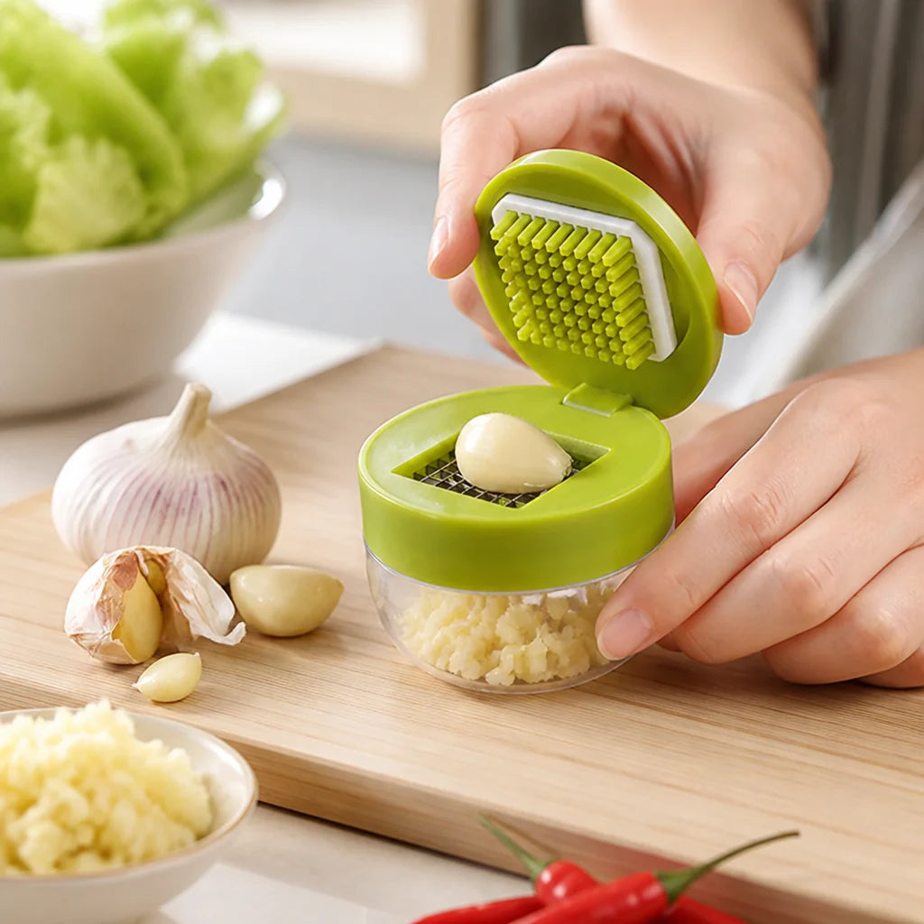 Fine garlic press with clear container