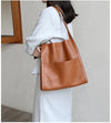 Leather carrying bag with multiple compartments